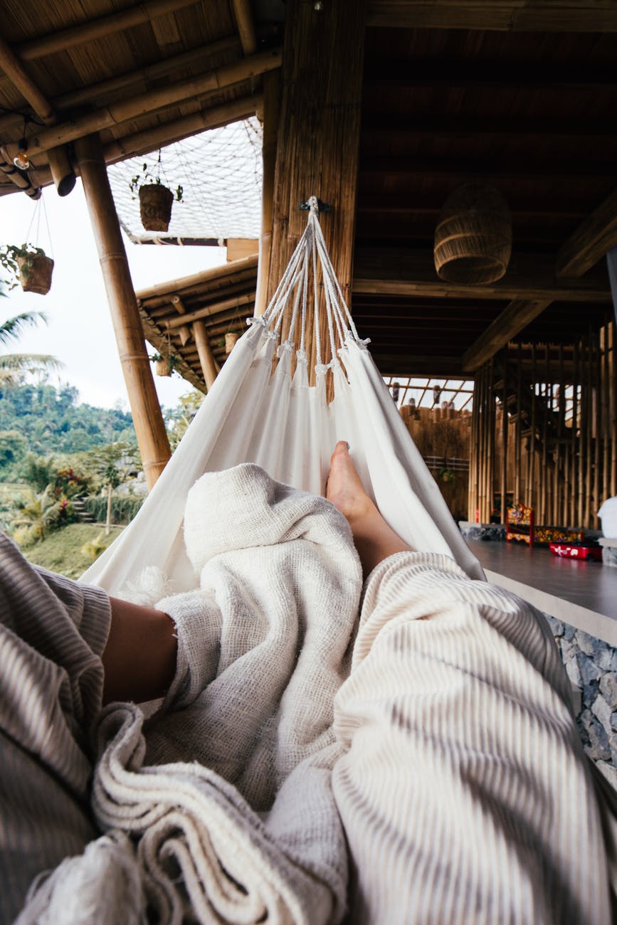faceless person resting on hammock for 5 things to do to make your weekend stress-free post. 
