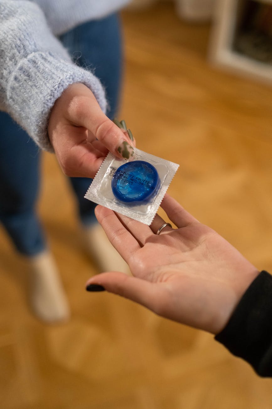 handing out blue condom for contraceptive implant - my story post.